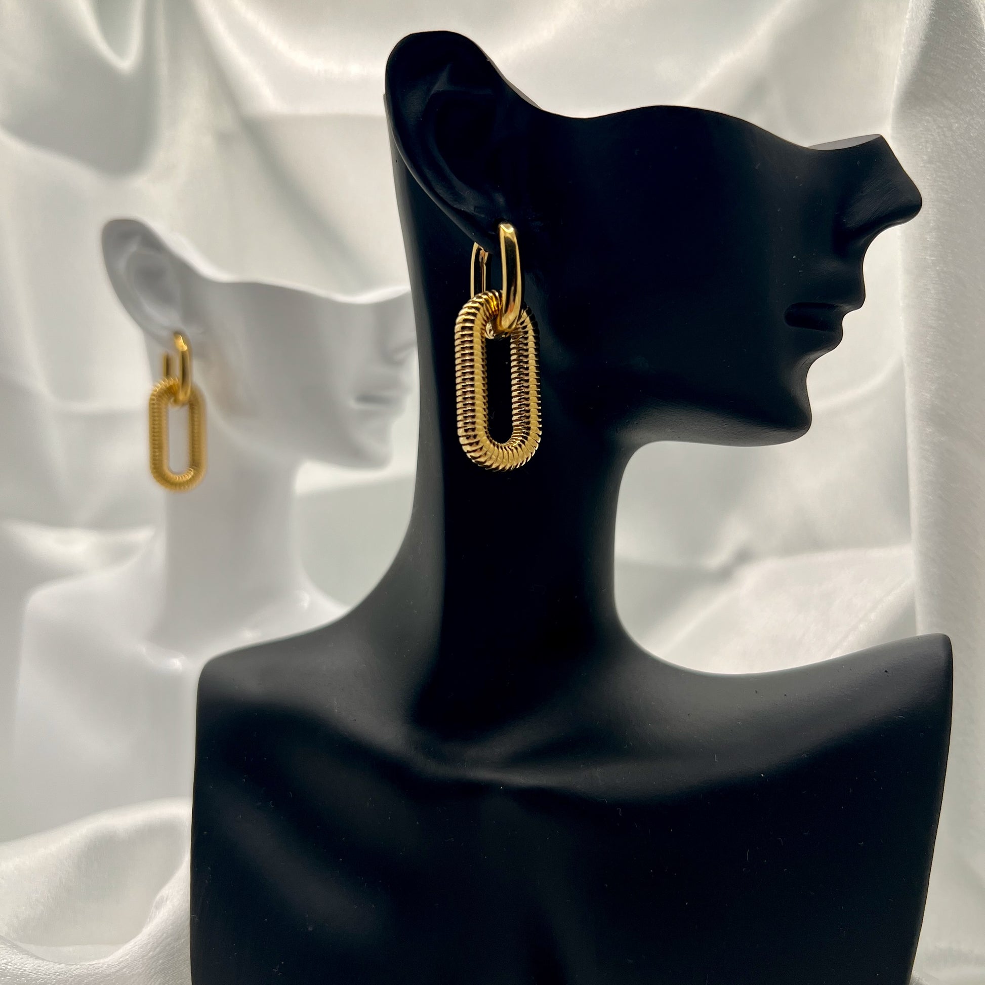 gold link earrings worn on ear everyday minimalist gold jewelry look